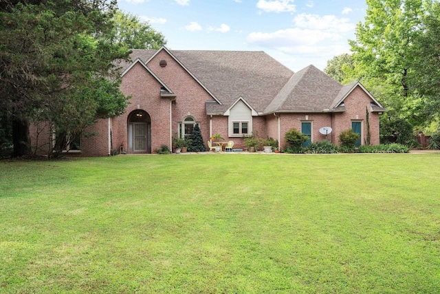 6500 State Line Rd, Tn, TN 38141 - traditional home with brick siding, a front yard, and a shingled roof