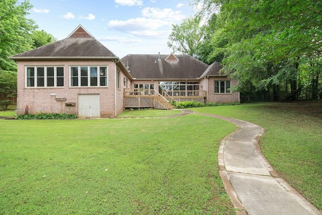 6500 State Line Rd, Tn, TN 38141 - rear view of house featuring brick siding, a wooden deck, a lawn, stairway, and a shingled roof