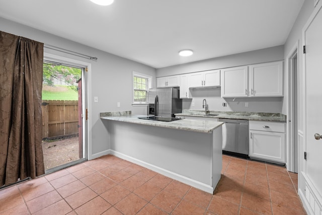 5686 Quince Rd Unit 3, Memphis, TN 38119 - kitchen featuring appliances with stainless steel finishes, light tile patterned flooring, and white cabinetry