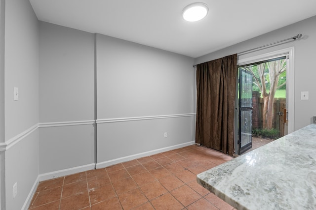 5686 Quince Rd Unit 3, Memphis, TN 38119 - tiled bedroom featuring access to outside and baseboards