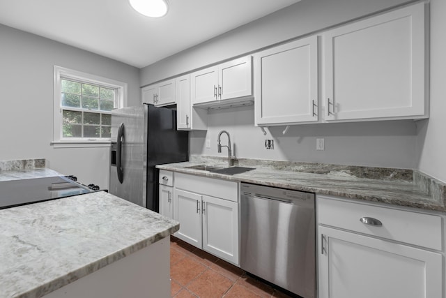 5686 Quince Rd Unit 3, Memphis, TN 38119 - kitchen featuring appliances with stainless steel finishes, white cabinets, light stone counters, and tile patterned floors