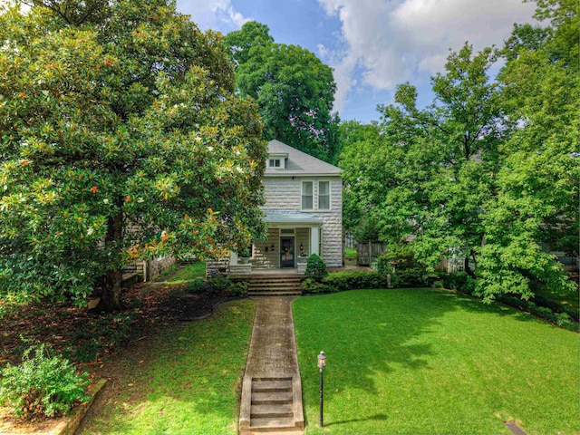 1692 Carruthers Pl, Memphis, TN 38112 - view of front facade featuring covered porch and a front yard