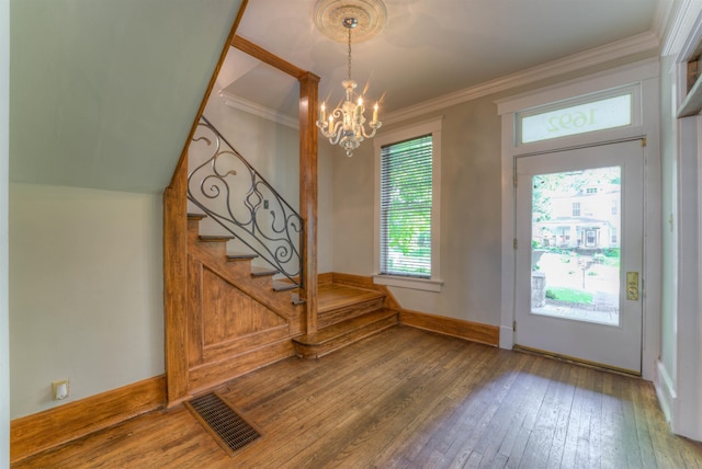 1692 Carruthers Pl, Memphis, TN 38112 - entryway with stairway, a chandelier, wood-type flooring, plenty of natural light, and crown molding