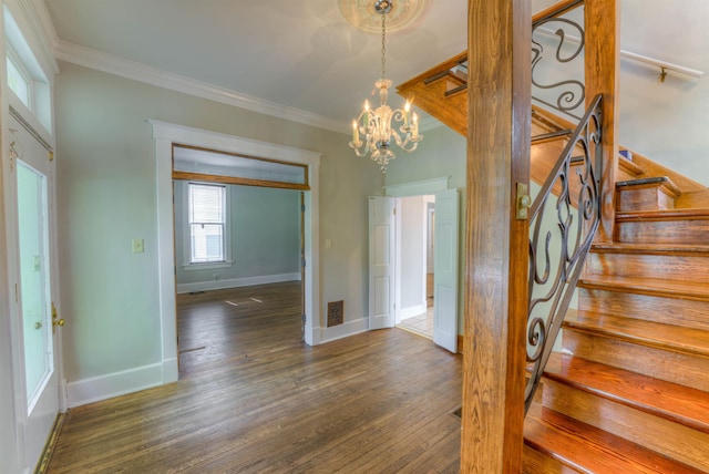 1692 Carruthers Pl, Memphis, TN 38112 - entrance foyer with crown molding, stairway, a chandelier, and dark wood-style flooring
