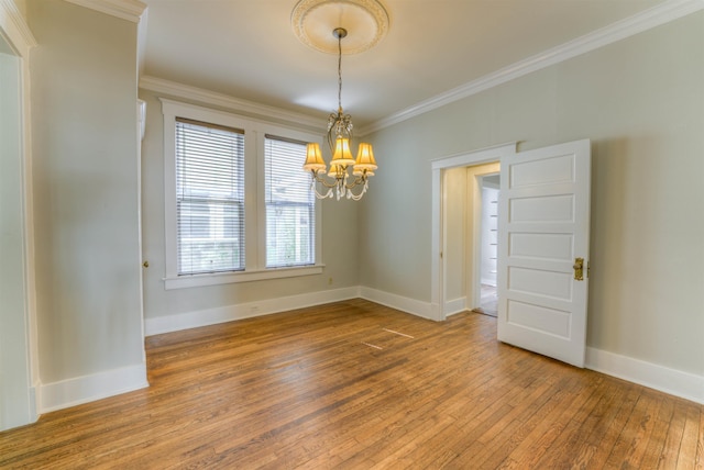 1692 Carruthers Pl, Memphis, TN 38112 - unfurnished room with a chandelier, hardwood / wood-style flooring, and ornamental molding