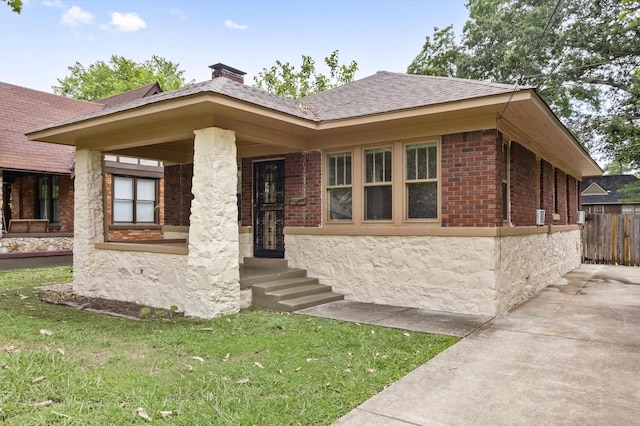 730 Maury St, Memphis, TN 38107 - view of front facade with a chimney, a shingled roof, and brick siding