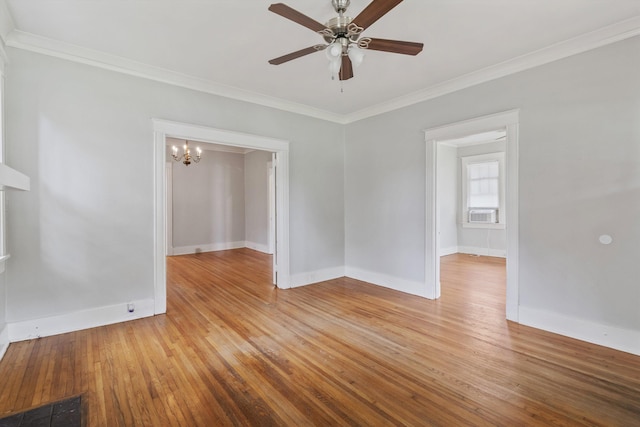 730 Maury St, Memphis, TN 38107 - unfurnished room featuring light wood finished floors, crown molding, a ceiling fan, a chandelier, and cooling unit