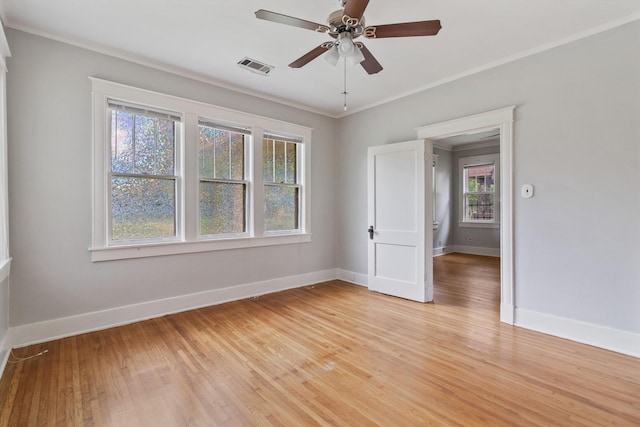 730 Maury St, Memphis, TN 38107 - unfurnished room with crown molding, light wood-type flooring, and ceiling fan