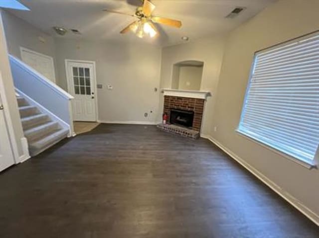 1017 Cordova Ridge Pl, Cordova, TN 38018 - unfurnished living room featuring a fireplace, ceiling fan, stairway, and wood finished floors