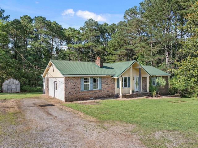 18 County Road 252nd Rd, Glen, MS 38846 - ranch-style house featuring a chimney, a shed, a front lawn, a metal roof, and brick siding