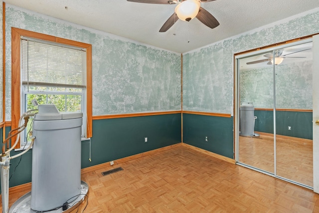 18 County Road 252nd Rd, Glen, MS 38846 - unfurnished room with a ceiling fan, wallpapered walls, and a textured ceiling