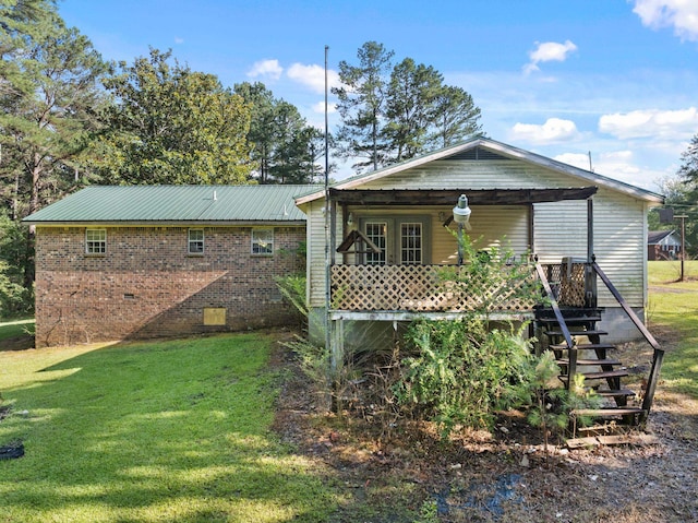 18 County Road 252nd Rd, Glen, MS 38846 - back of house with a yard, stairway, crawl space, and brick siding