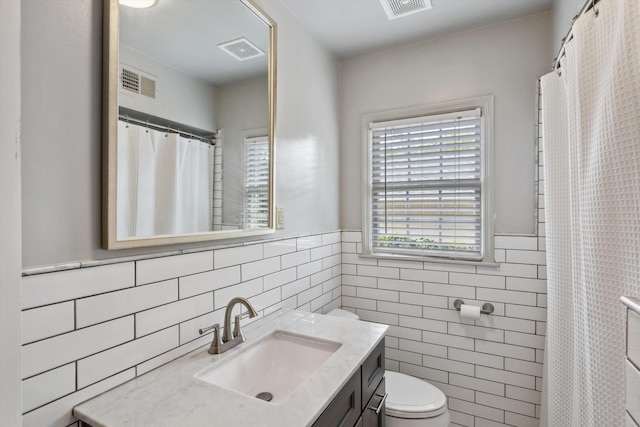 215 Belhaven St, Memphis, TN 38117 - full bath with tile walls, vanity, and wainscoting