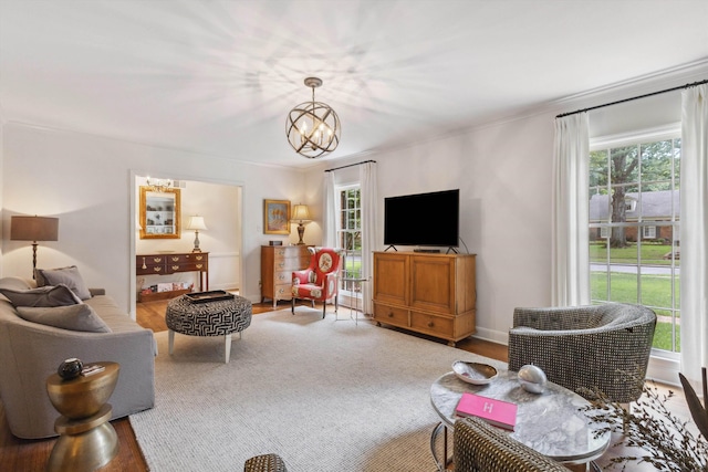 215 Belhaven St, Memphis, TN 38117 - living room with plenty of natural light, a chandelier, and wood finished floors