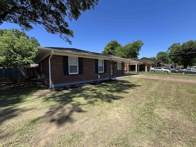 4080 Northbridge Ave, Memphis, TN 38118 - ranch-style house with brick siding, a carport, and driveway