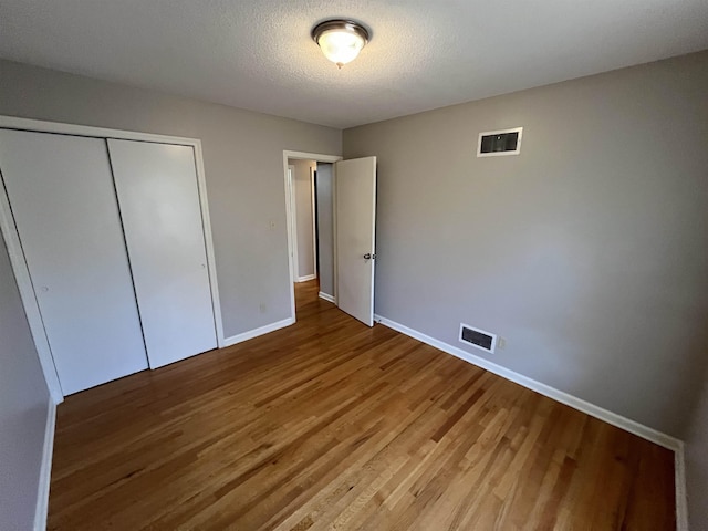 4080 Northbridge Ave, Memphis, TN 38118 - unfurnished bedroom with wood finished floors and a closet