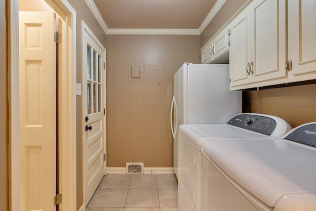 2030 Quail Creek Cv, Memphis, TN 38119 - laundry area featuring cabinet space, electric panel, independent washer and dryer, crown molding, and light tile patterned flooring