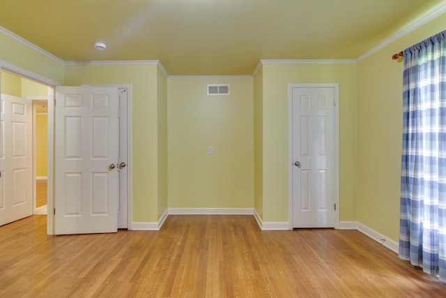 2030 Quail Creek Cv, Memphis, TN 38119 - unfurnished bedroom with light wood-type flooring and crown molding