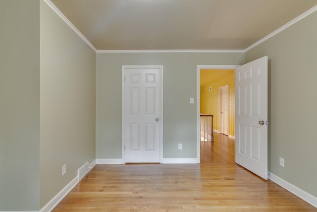 2030 Quail Creek Cv, Memphis, TN 38119 - unfurnished bedroom featuring crown molding and light wood-style flooring