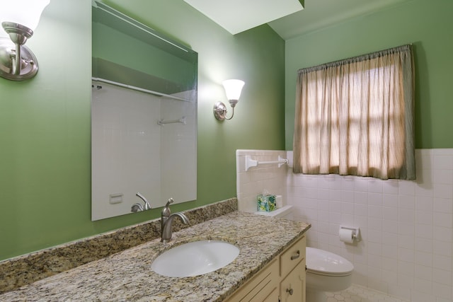 2030 Quail Creek Cv, Memphis, TN 38119 - bathroom featuring tile walls, a shower, vanity, and wainscoting