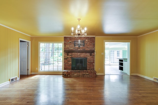 2030 Quail Creek Cv, Memphis, TN 38119 - unfurnished living room with wood finished floors, ornamental molding, healthy amount of natural light, and a chandelier