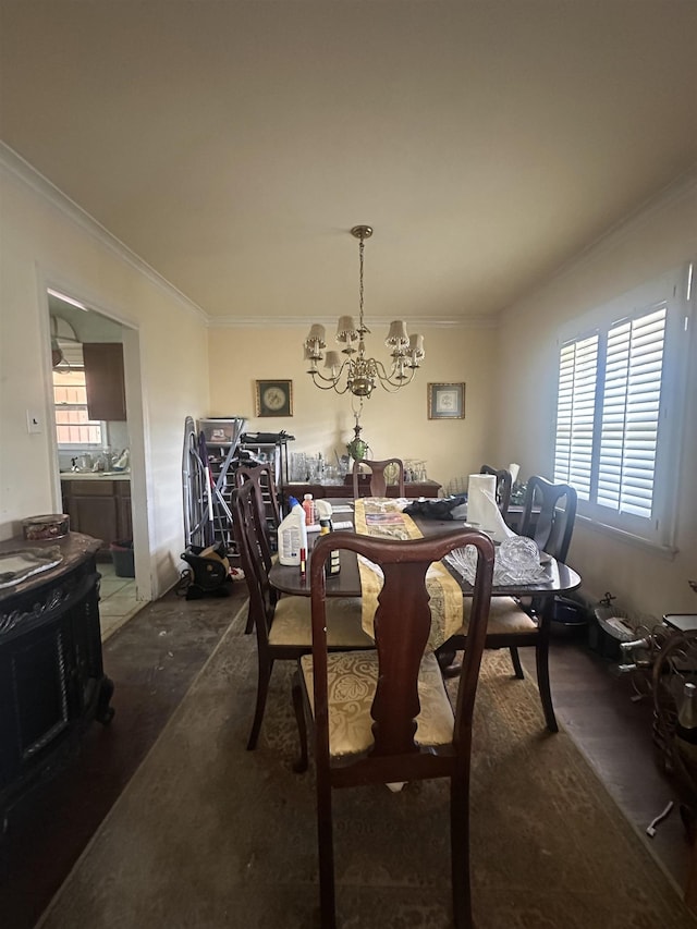 1407 Worthington St, Memphis, TN 38114 - dining area featuring crown molding, a chandelier, and healthy amount of natural light