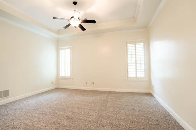 3485 E Taplow Way E, Collierville, TN 38017 - empty room with a tray ceiling, healthy amount of natural light, crown molding, carpet flooring, and ceiling fan