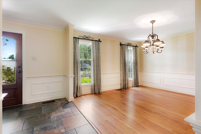 7802 Foster Ridge Dr, Germantown, TN 38138 - entryway with a chandelier, ornamental molding, a decorative wall, and wainscoting