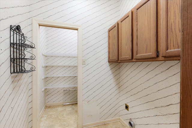 7802 Foster Ridge Dr, Germantown, TN 38138 - laundry area with cabinet space and electric dryer hookup