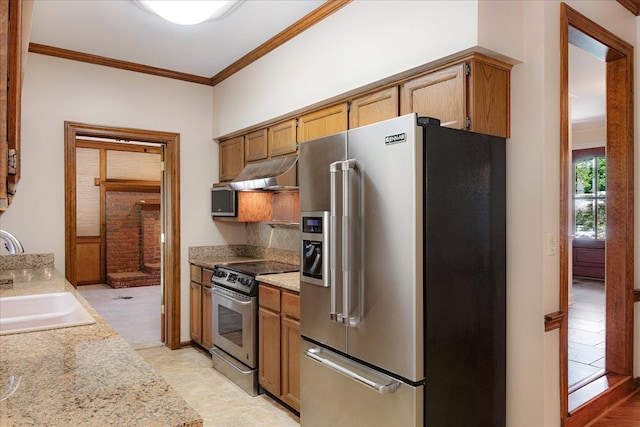 7802 Foster Ridge Dr, Germantown, TN 38138 - kitchen featuring stainless steel appliances, under cabinet range hood, ornamental molding, light countertops, and brown cabinets