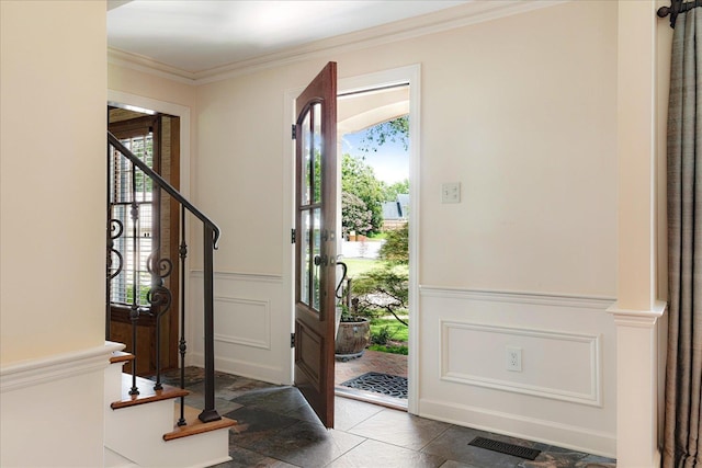 7802 Foster Ridge Dr, Germantown, TN 38138 - entryway featuring stairs, ornamental molding, stone tile flooring, a wainscoted wall, and a decorative wall