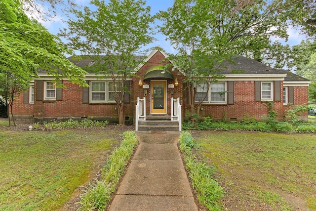 3541 Aurora Cir, Memphis, TN 38111 - view of front of home featuring brick siding, crawl space, and a front lawn