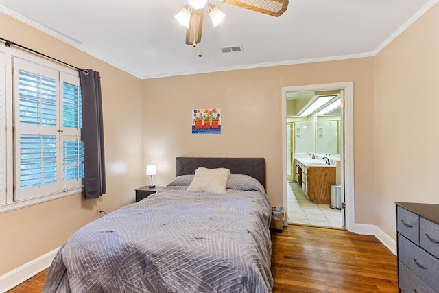 3541 Aurora Cir, Memphis, TN 38111 - bedroom with wood finished floors, ornamental molding, ensuite bathroom, and ceiling fan