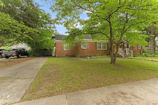 3541 Aurora Cir, Memphis, TN 38111 - view of front of home featuring brick siding, concrete driveway, a front yard, and crawl space