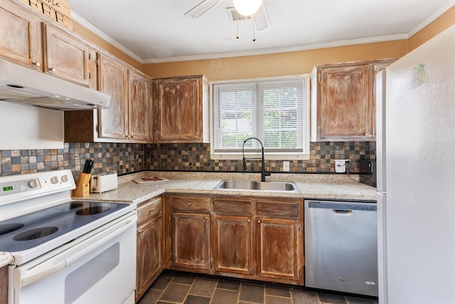 3541 Aurora Cir, Memphis, TN 38111 - kitchen featuring white appliances, under cabinet range hood, decorative backsplash, light countertops, and crown molding