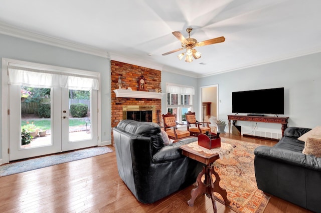2671 Maple Grove Cv S, Germantown, TN 38139 - living room with ornamental molding, ceiling fan, wood-type flooring, a fireplace, and french doors