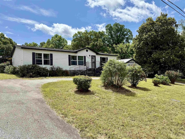 4392 Society Rd, Bartlett, TN 38002 - manufactured / mobile home featuring a front lawn and asphalt driveway