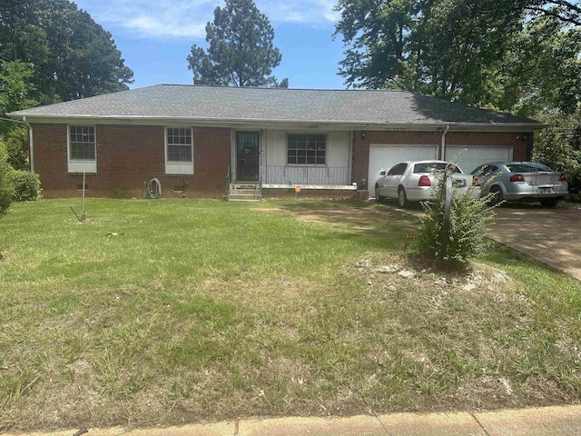 1638 Hester Dr, Memphis, TN 38116 - single story home with an attached garage, a front yard, driveway, and brick siding