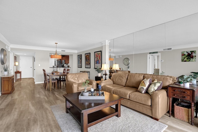 200 Wagner Pl Unit 804, Memphis, TN 38103 - living area with light wood finished floors and ornamental molding