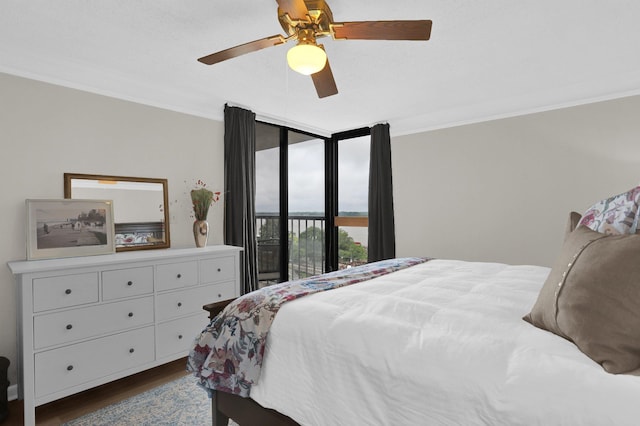 200 Wagner Pl Unit 804, Memphis, TN 38103 - bedroom featuring ornamental molding, access to outside, dark wood-style flooring, and ceiling fan