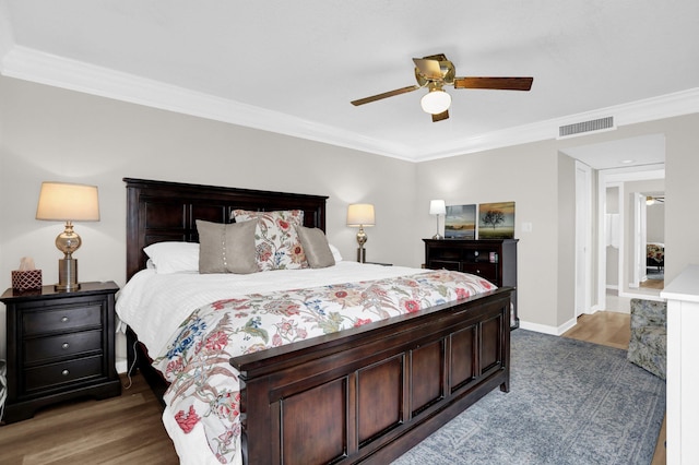 200 Wagner Pl Unit 804, Memphis, TN 38103 - bedroom with dark wood-type flooring, crown molding, and ceiling fan