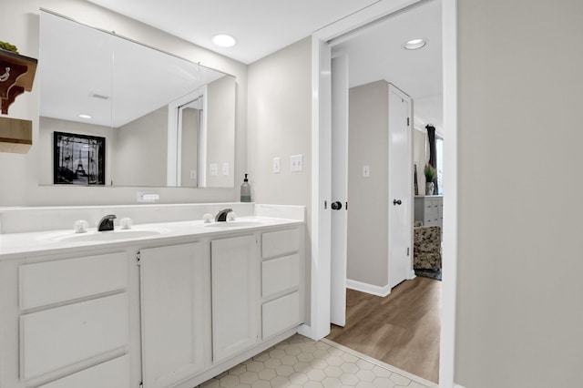 200 Wagner Pl Unit 804, Memphis, TN 38103 - bathroom with double vanity, tile patterned floors, and recessed lighting