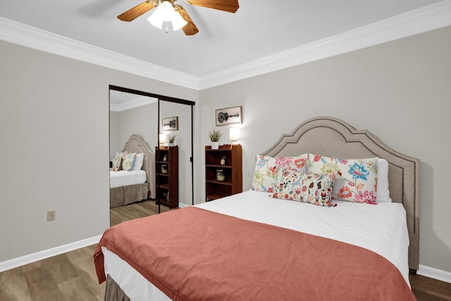 200 Wagner Pl Unit 804, Memphis, TN 38103 - bedroom featuring wood finished floors, crown molding, a ceiling fan, and a closet