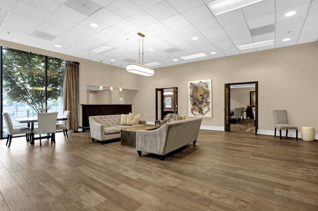 200 Wagner Pl Unit 804, Memphis, TN 38103 - living room with wood finished floors, a drop ceiling, and a wall of windows