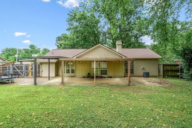 3333 Sycamore View Rd, Bartlett, TN 38134 - back of property featuring a patio, a fenced backyard, a chimney, and roof with shingles