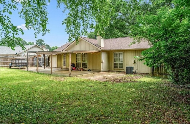 3333 Sycamore View Rd, Bartlett, TN 38134 - back of property featuring a fenced backyard, a patio, a chimney, and roof with shingles