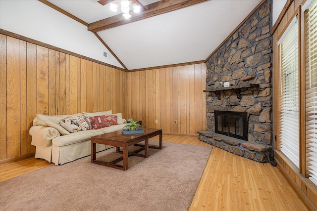 3333 Sycamore View Rd, Bartlett, TN 38134 - living room featuring wood finished floors, wood walls, a stone fireplace, and ceiling fan