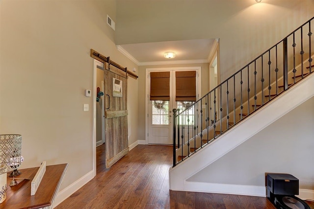 280 Cotton Trail Dr, Rossville, TN 38066 - entrance foyer with stairs, a barn door, ornamental molding, and wood finished floors