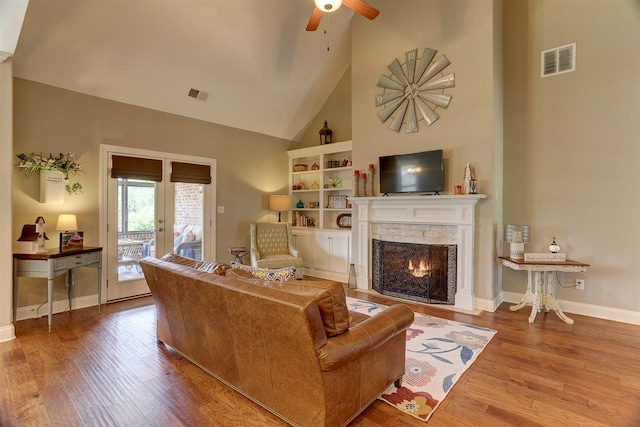 280 Cotton Trail Dr, Rossville, TN 38066 - living area featuring high vaulted ceiling, a ceiling fan, wood finished floors, a fireplace, and french doors