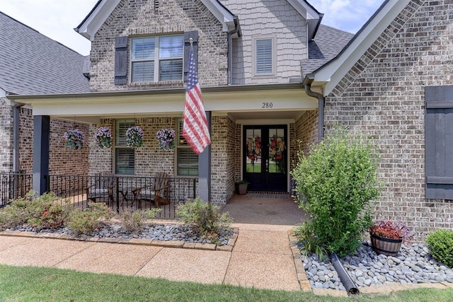 280 Cotton Trail Dr, Rossville, TN 38066 - doorway to property featuring french doors, brick siding, a porch, and a shingled roof
